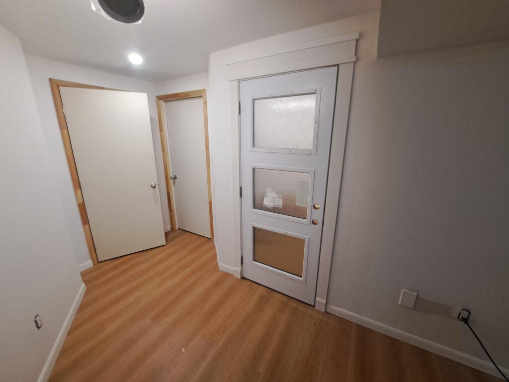 Basement interior doors casing baseboard and exterior door surround in Burlington