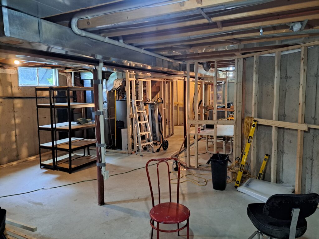 Interior wall and bulkhead framing during a Burlington Millcroft basement renovation