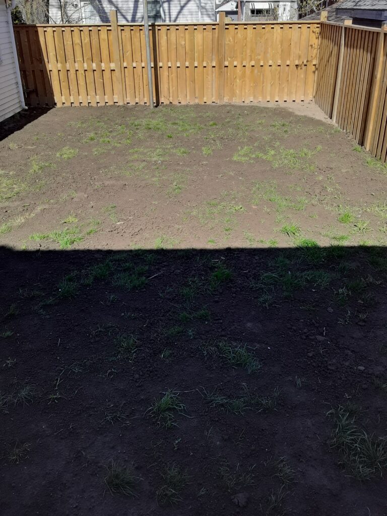 Completed wood privacy fence around a residential backyard in Hamilton Ontario