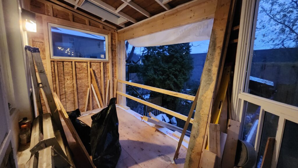Framed structural opening for a sliding glass door leading to a new Dundas deck
