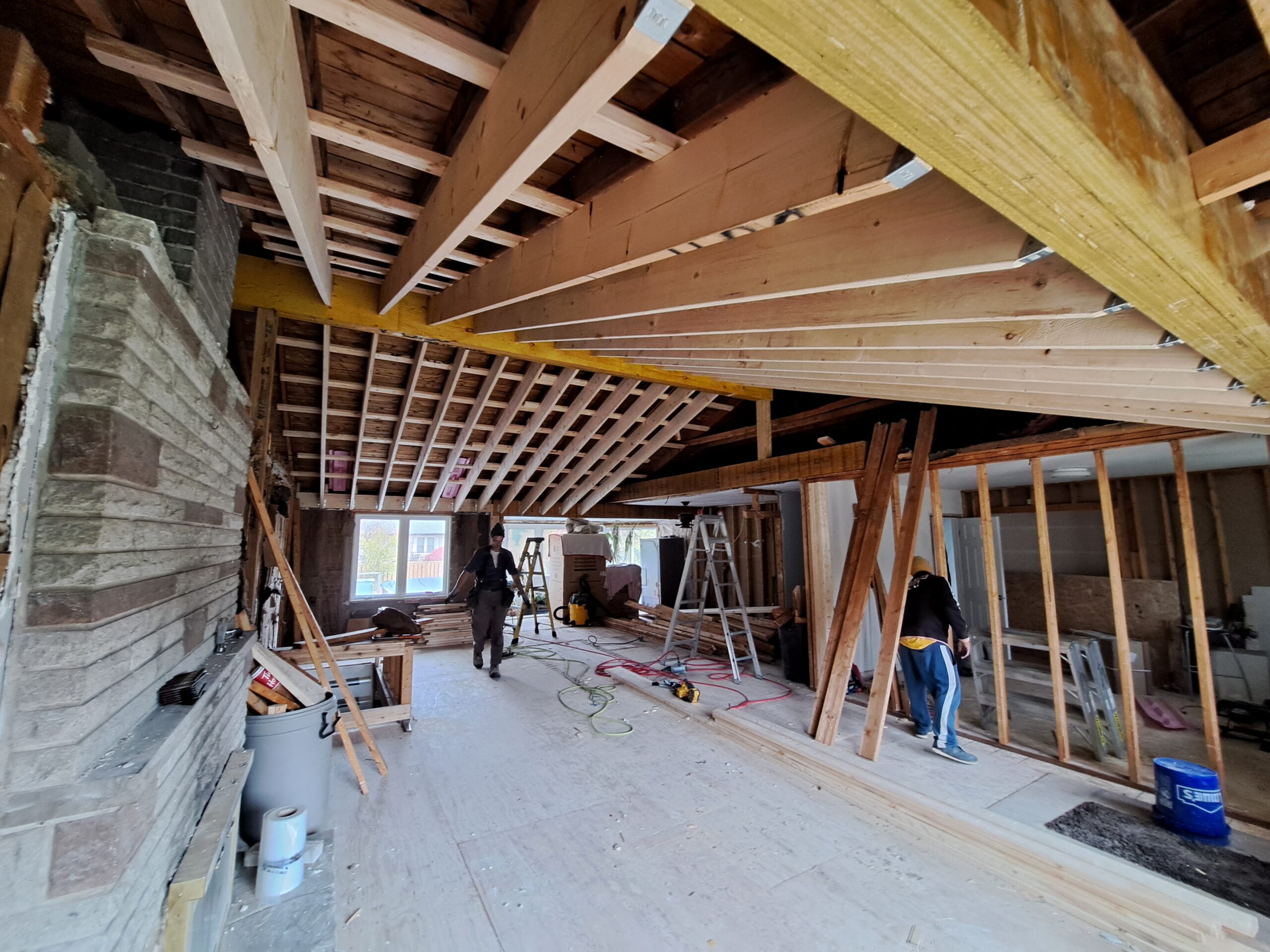 Four new structural beams and cathedral ceiling framing during an open-concept Burlington renovation