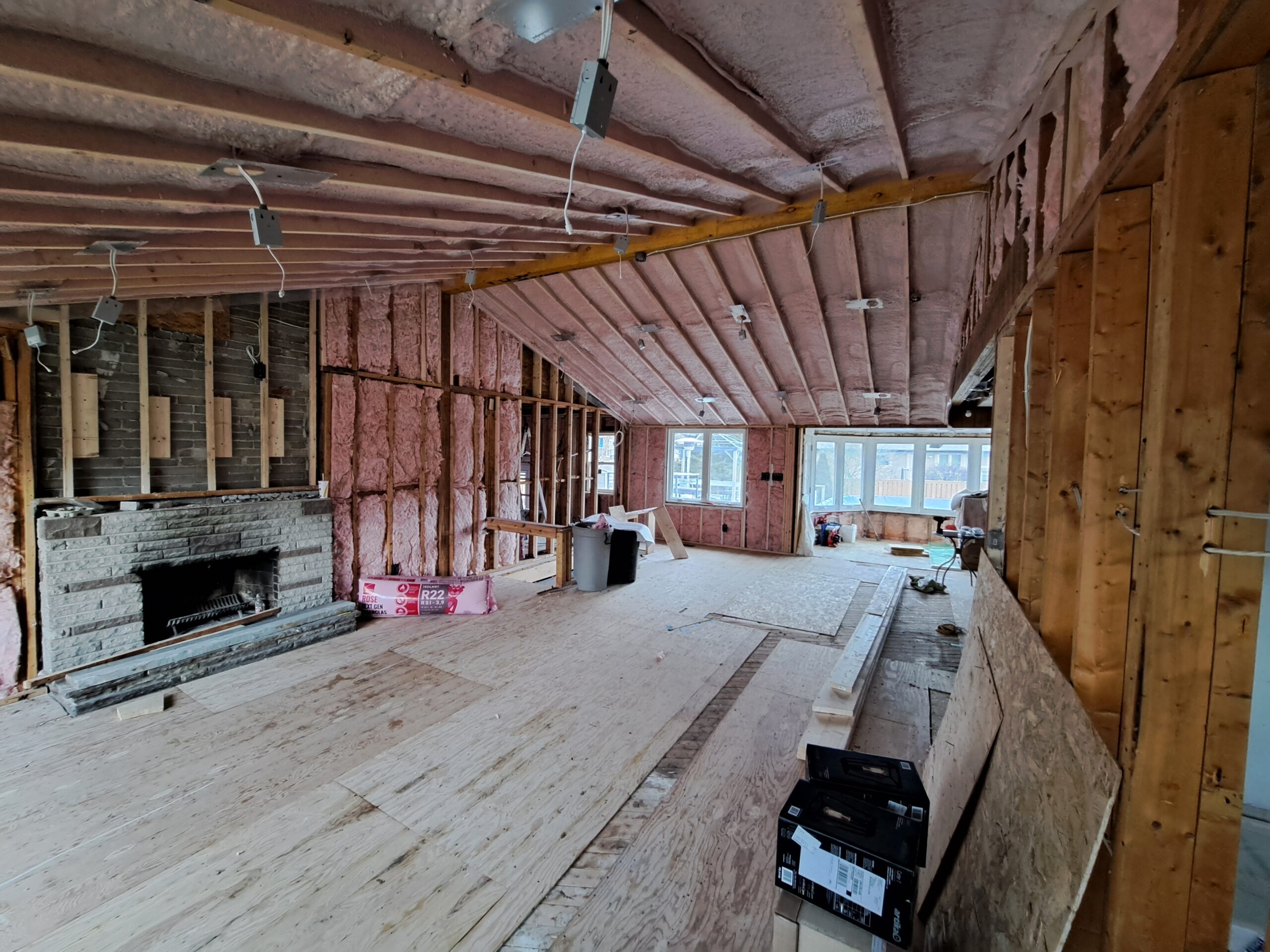 Insulated cathedral ceiling showing the open kitchen and living-room framing layout in Burlington
